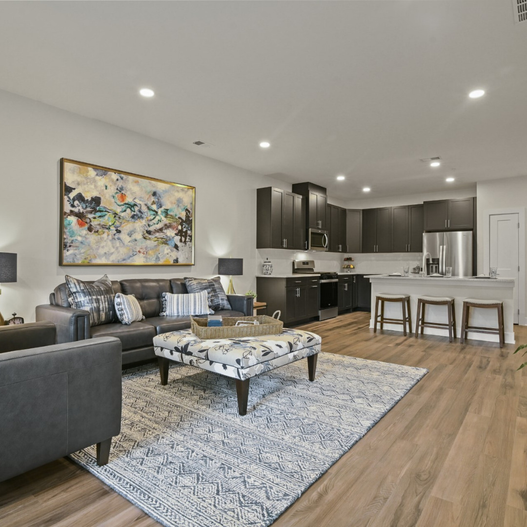 Modern open-concept kitchen and living room in a newly constructed Country Classics home in Central New Jersey
