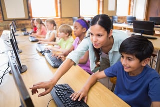 bigstock-Cute-pupils-in-computer-class--85197671.jpg