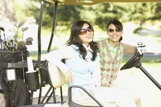 bigstock-Two-women-in-golf-cart-182505892.jpg